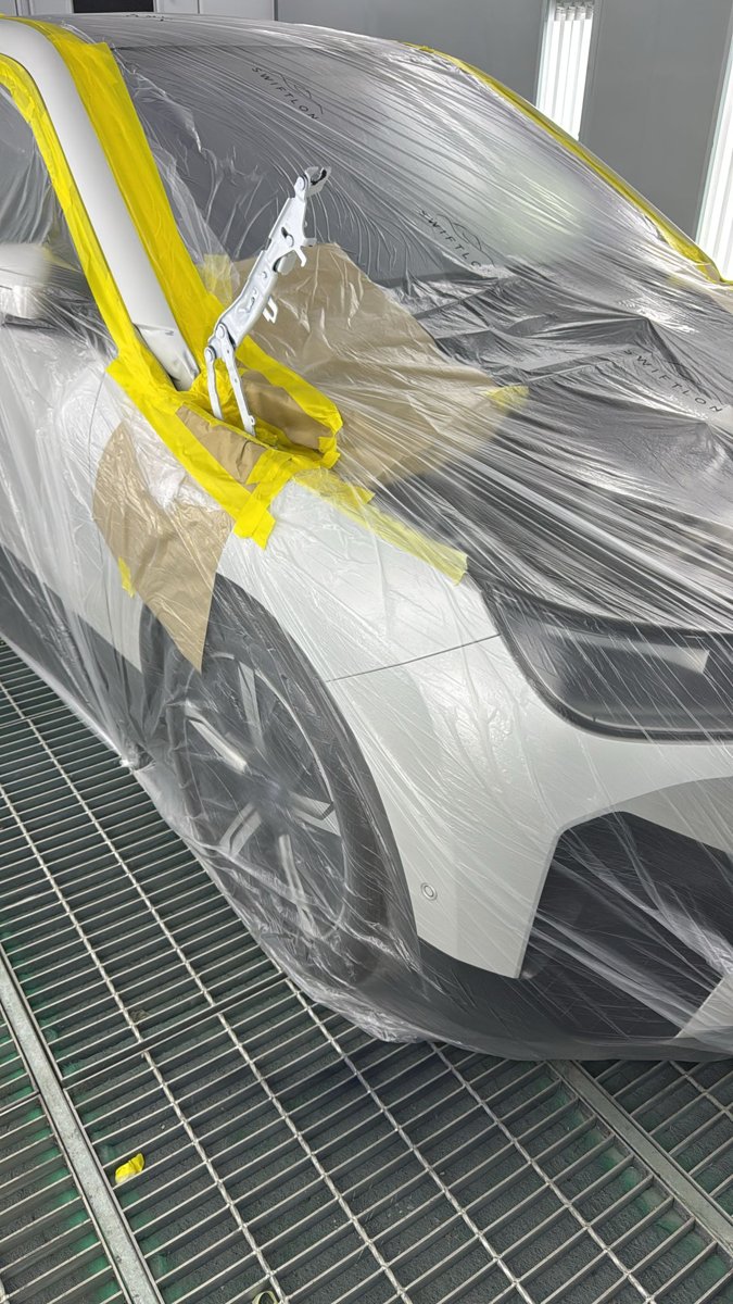 Vehicle fully masked up in the spray booth at Kings Langley